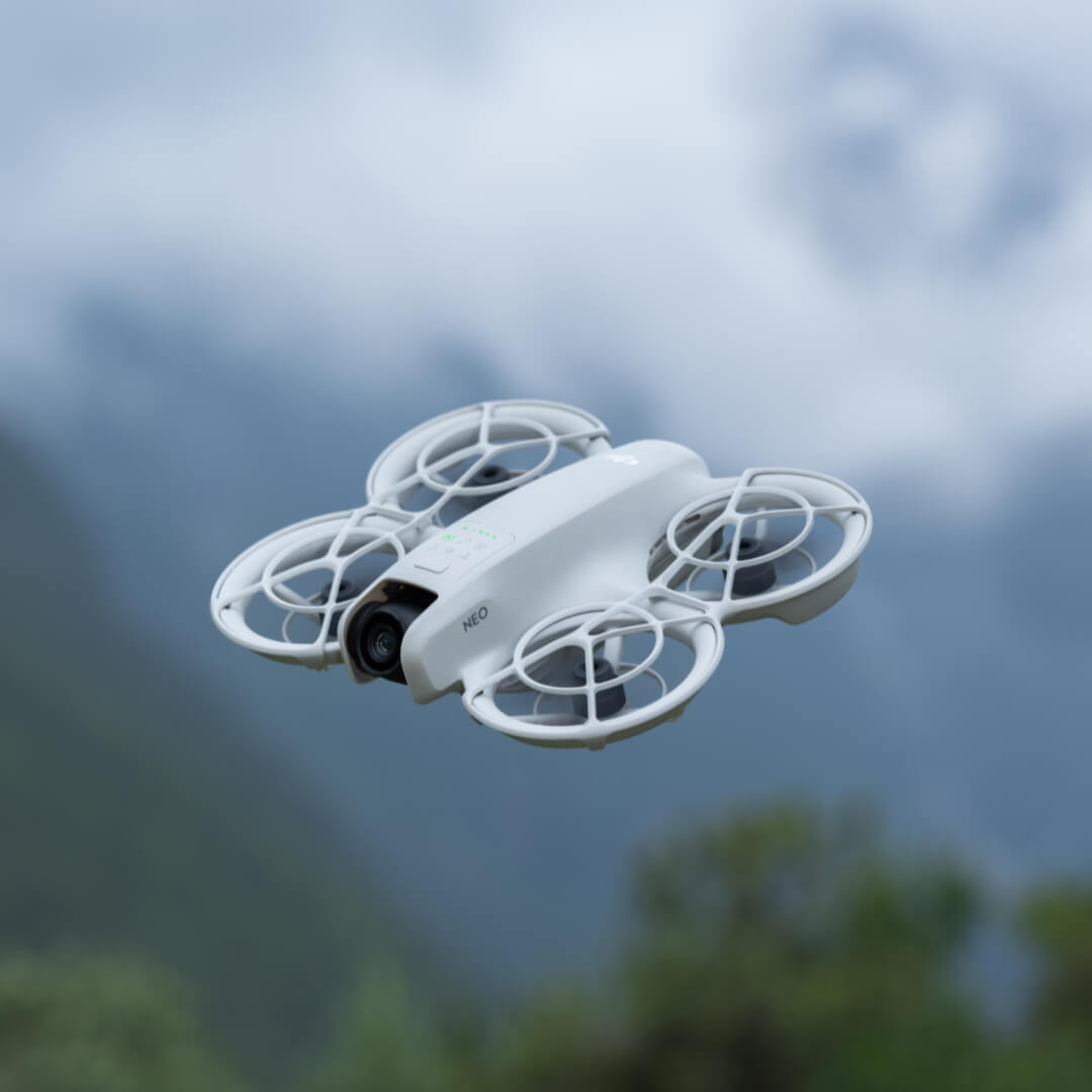 Neo drone flying against a blurred natural background
