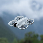 Neo drone flying against a blurred natural background