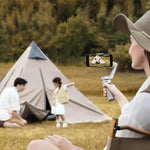 Woman filming a family camping outdoors with a smartphone and DJI Osmo Mobile SE handheld gimbal stabiliser