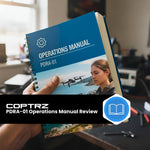 Operations manual titled 'PDRA-01' held by a person in a tech desk setting